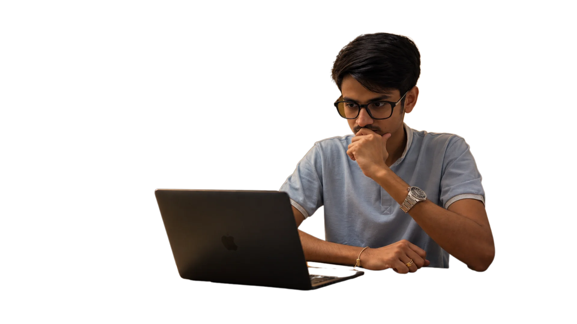 A business owner thinking while looking at his laptop